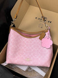 Coach Laurel Shoulder Bag
In Signature Canvas With Charms CEL12